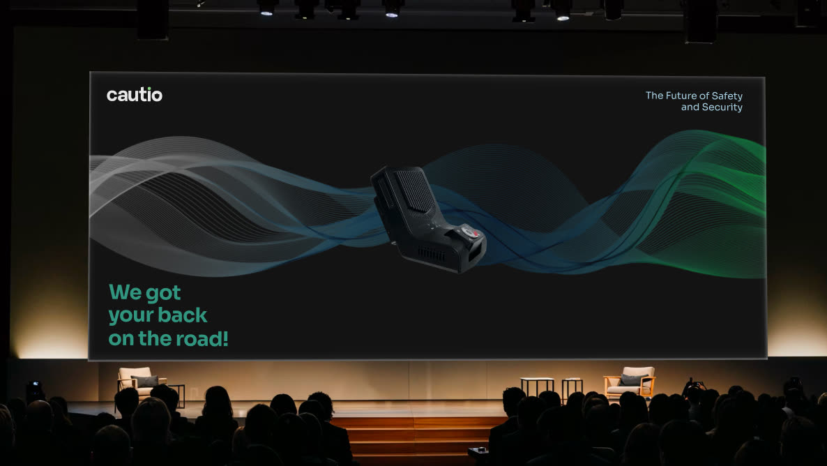 Cautio's dashcam launch presented on a stage screen
